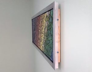 mosaic art mounted flush against the wall