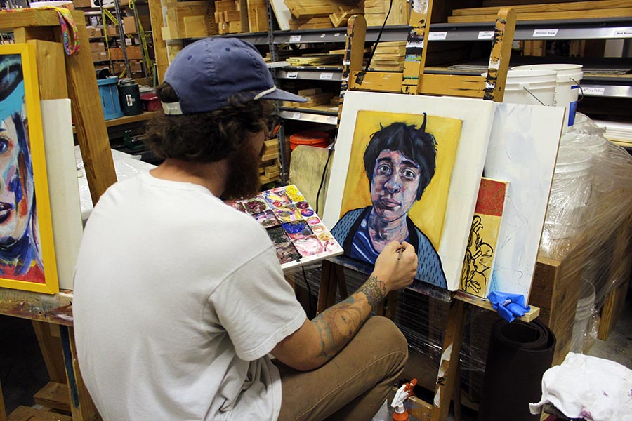 Lucas painting in studio