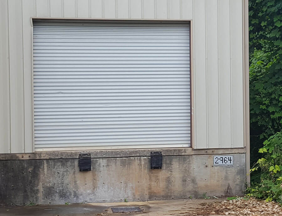 Mosaic Street Number on warehouse loading dock.