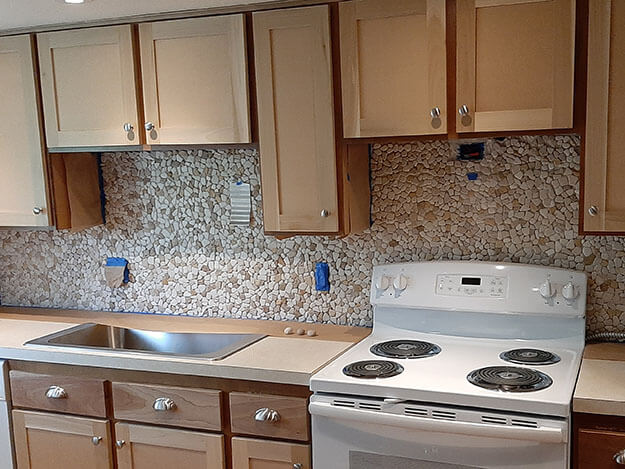 Stone Mosaic Backsplash before grouting cropped