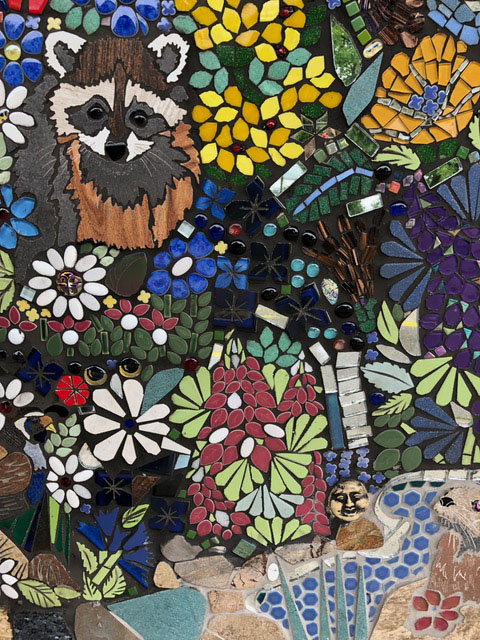 Tuolumne County School Mosaic Mural detail with raccoon and wildflowers.