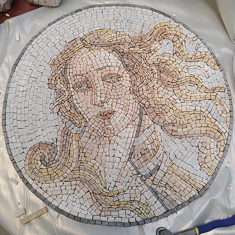 Mosaic interpretation of a detail from Botticelli's Venus restored but not yet sealed with stone enhancer.