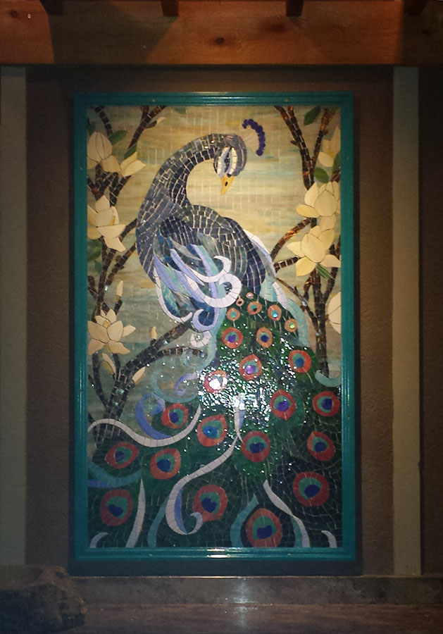 Mosaic Peacock by artist Lonnie Parsons, evening with overhead light.