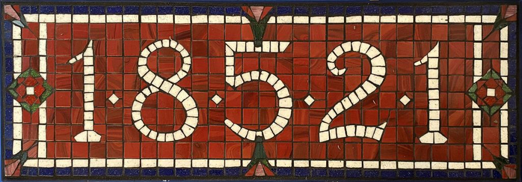 mosaic-street-number-sign-warm-indoor-light