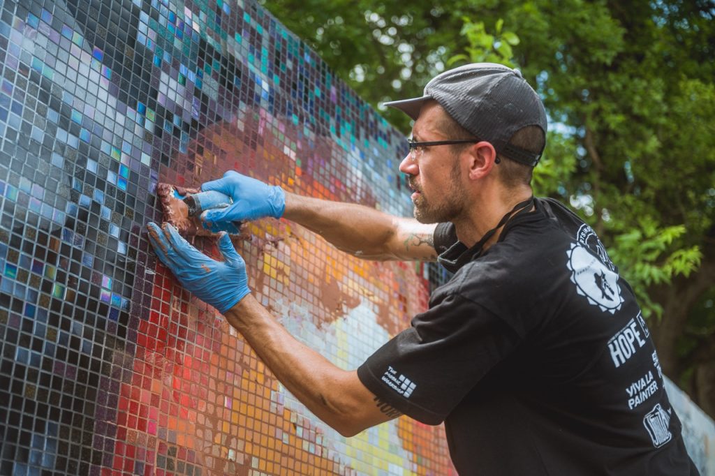 Grouting Mosaic Mural. Photo by Tony Moreno.